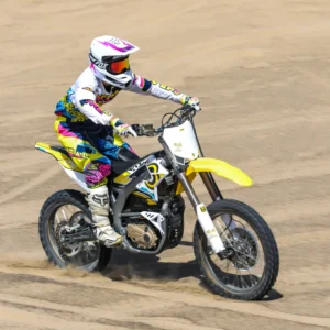 a-person-riding-a-surron-storm-bee-mx-electric-dirt-bike